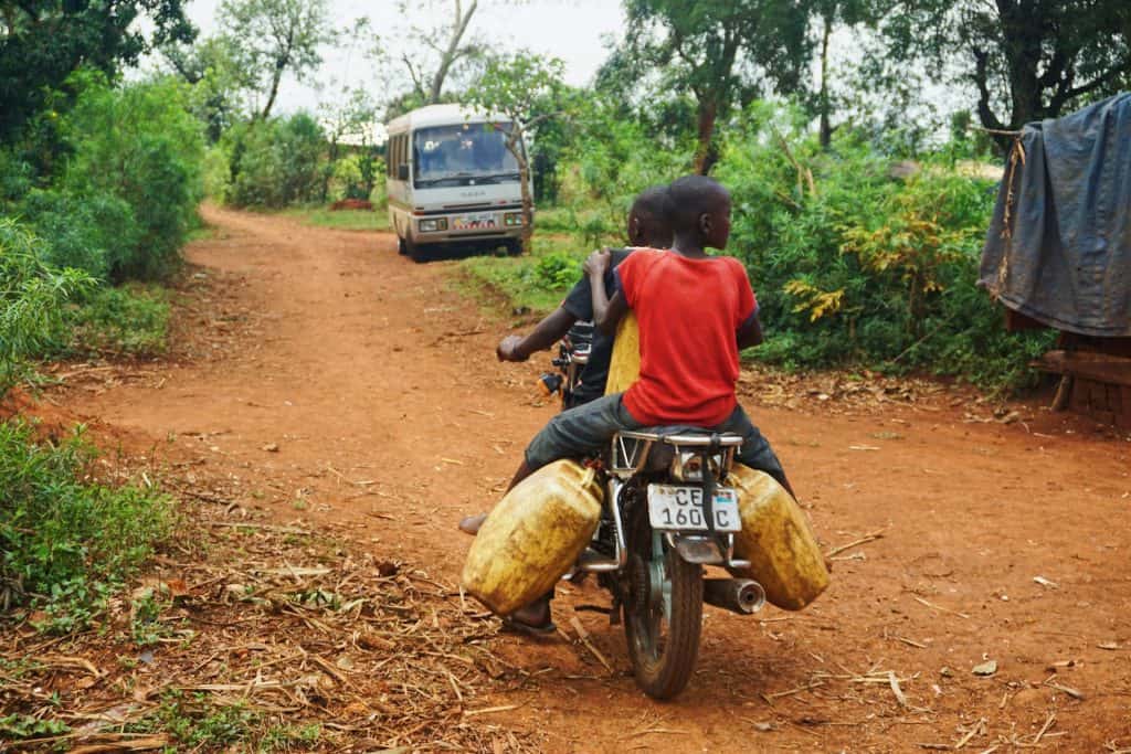 Two boys on a boda boda in Uganda