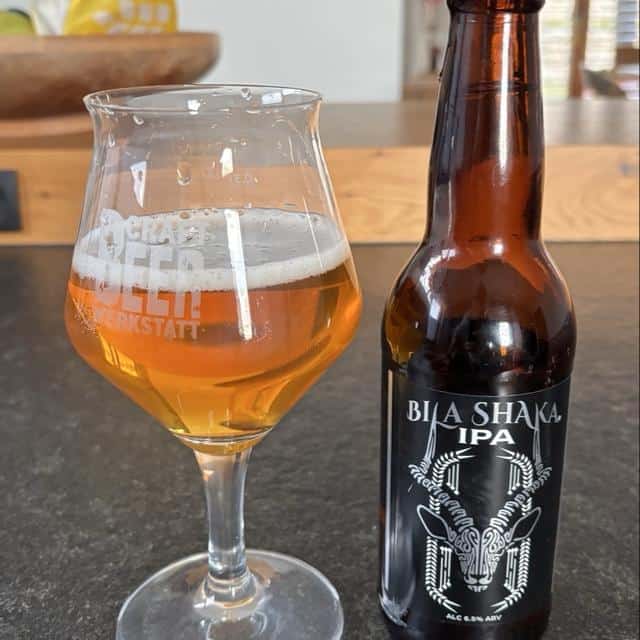 drinking a Bila Shaka beer in Kenya